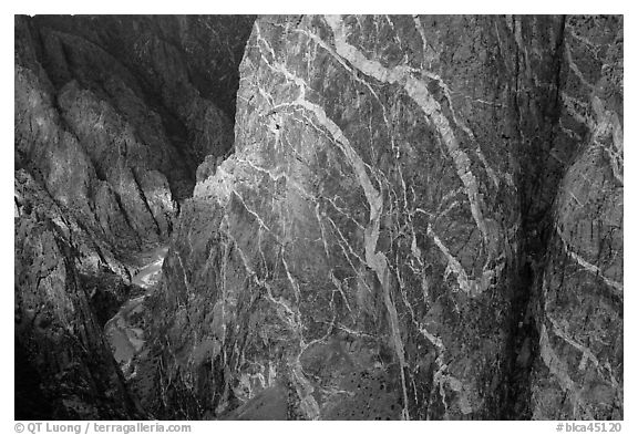 Wall with swirling veins of igneous pegmatite. Black Canyon of the Gunnison National Park, Colorado, USA.