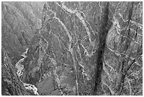 Stripes of pink and white crystalline pegmatite on rock wall. Black Canyon of the Gunnison National Park ( black and white)