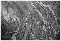 Sheer cliff with flourishes of crystalline pegmatite. Black Canyon of the Gunnison National Park ( black and white)