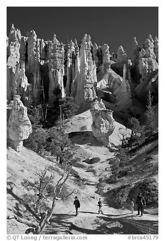 Hiker at the base of hoodoos. Bryce Canyon National Park, Utah, USA.