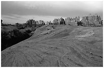 Sandstone swirls and Needles near Elephant Hill, sunset. Canyonlands National Park, Utah, USA. (black and white)