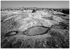 Empty pot holes on sandstone, Needles District. Canyonlands National Park ( black and white)