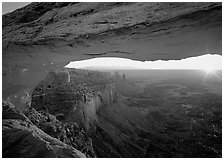 Sunrise through Mesa Arch, Island in the Sky. Canyonlands National Park, Utah, USA. (black and white)