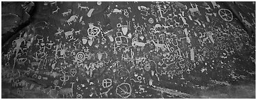 Petroglyphs on rock slab, Newspaper Rock. Bears Ears National Monument, Utah, USA (Panoramic black and white)
