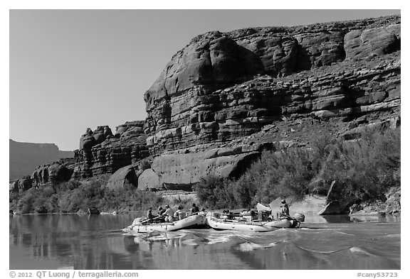 Rafts motoring upstream Colorado River. Canyonlands National Park, Utah, USA.
