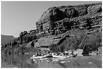 Rafts motoring upstream Colorado River. Canyonlands National Park, Utah, USA. (black and white)