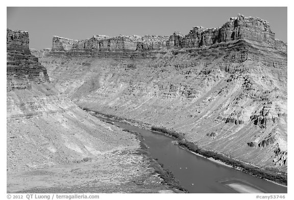 Distant views of rafts floating Colorado River. Canyonlands National Park, Utah, USA.