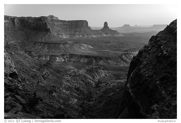 Cliffs and Candlestick Butte at dusk. Canyonlands National Park, Utah, USA.