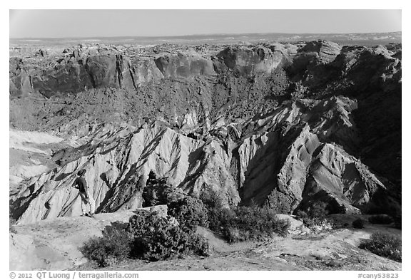 Person looking, Upheaval Dome. Canyonlands National Park, Utah, USA.