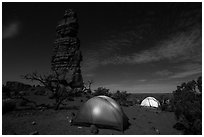 Tents at night below Standing Rock. Canyonlands National Park, Utah, USA. (black and white)