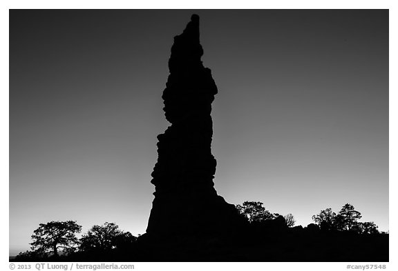 Standing Rock silhouette at sunrise. Canyonlands National Park, Utah, USA.