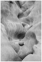 Sandstone waves and stone, High Spur slot canyon, Orange Cliffs Unit, Glen Canyon National Recreation Area, Utah. USA ( black and white)