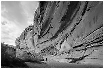 Hiker looking, the Great Gallery, Horseshoe Canyon. Canyonlands National Park, Utah, USA. (black and white)
