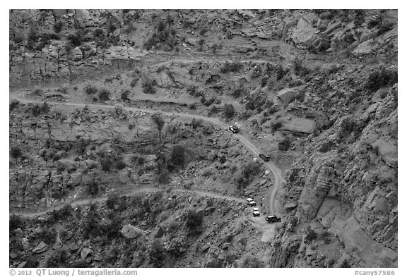 Jeep caravan negotiates hairpin turn on the Flint Trail,  Orange Cliffs Unit, Glen Canyon National Recreation Area, Utah. USA