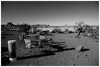 Backcountry camp chairs and tables, Standing Rocks campground. Canyonlands National Park, Utah, USA. (black and white)