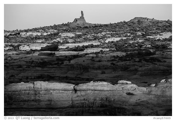 Maze and Chimney Rock at sunset, land of Standing rocks. Canyonlands National Park, Utah, USA.