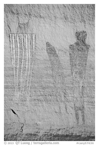 Bowing to large anthropomorphic figure with white stripes, Harvest Scene. Canyonlands National Park (black and white)