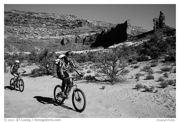 Mountain bikers in Teapot Canyon, Maze District. Canyonlands National Park, Utah, USA.