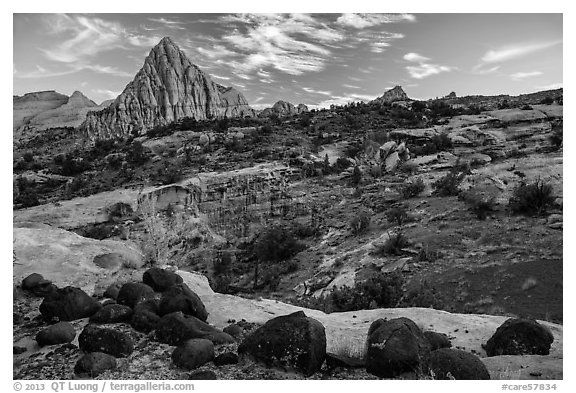 Black volcanic boulders and Pectol Pyramid. Capitol Reef National Park, Utah, USA.