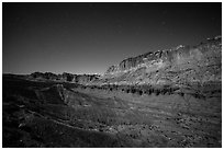 Fluted cliffs of Waterpocket Fold at night. Capitol Reef National Park, Utah, USA. (black and white)