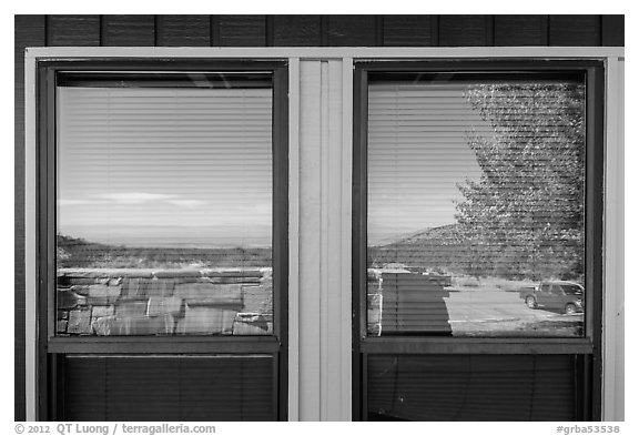 Parking lot and Basin open view, Lehman Caves visitor Center window reflexion. Great Basin National Park (black and white)