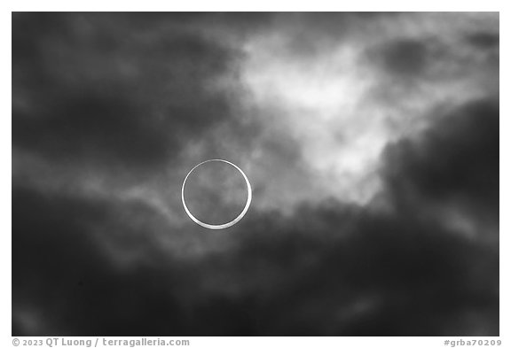 Sun and clouds, begining of annularity, eclipse of Oct 14, 2023. Great Basin National Park, Nevada, USA.