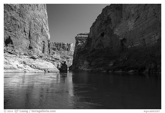 River-level view of redwall limestone canyon walls dropping straight into Colorado River. Grand Canyon National Park (black and white)