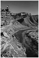 Photographer on sheer cliff above Unkar rapids. Grand Canyon National Park ( black and white)