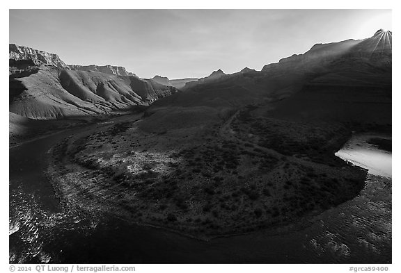 Sunburst on rim above Unkar rapids river bend. Grand Canyon National Park (black and white)