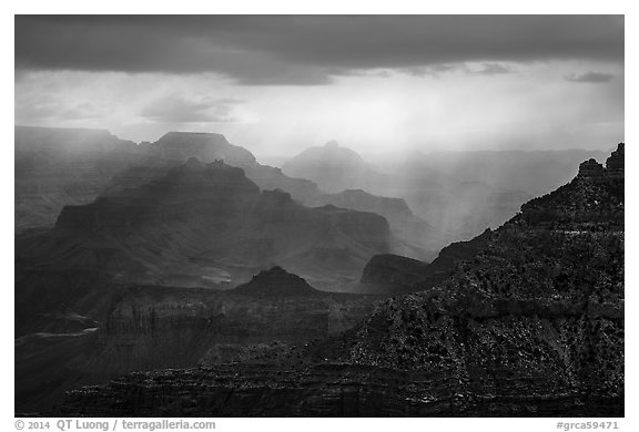Canyon ridges with dramatic clouds and sunrays. Grand Canyon National Park (black and white)