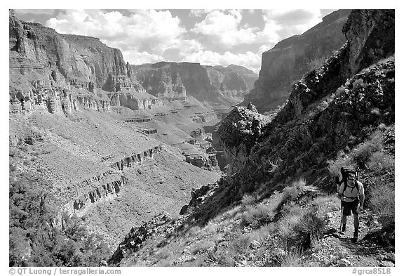 Backpacker on trail above Tapeats Creekr. Grand Canyon National Park, Arizona, USA.