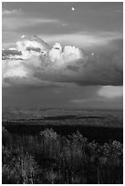 Moon, thunderstorm cloud over mesas at sunset. Mesa Verde National Park, Colorado, USA. (black and white)