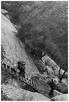 Park rangers descend ladder. Mesa Verde National Park ( black and white)