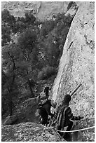 Tour participants negotiate cliff. Mesa Verde National Park ( black and white)