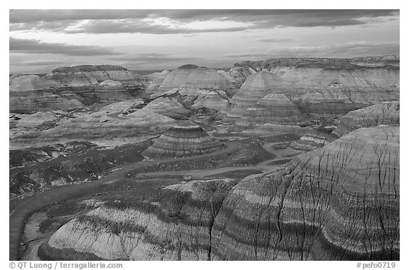 Multi-hued badlands of Blue Mesa, sunset. Petrified Forest National Park, Arizona, USA.