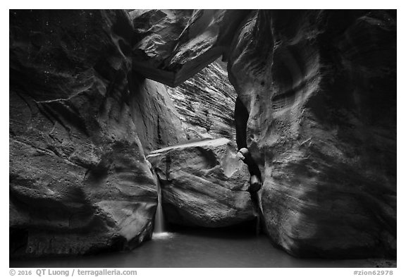 Large boulder creating waterfall with a second boulder suspended above, Orderville Canyon. Zion National Park (black and white)
