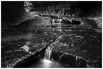 Cascades in tunnel-shaped canyon, the Subway. Zion National Park ( black and white)