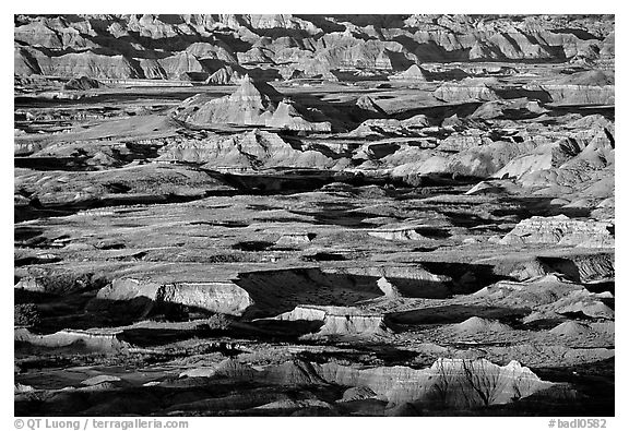 Badland ridges and prairie from above, sunrise. Badlands National Park, South Dakota, USA.