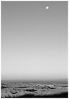 Sky, moon and badlands, sunrise. Badlands National Park, South Dakota, USA. (black and white)