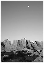 Moon and erosion formations, Cedar Pass, dawn. Badlands National Park, South Dakota, USA. (black and white)