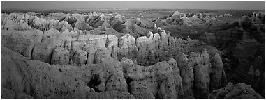 Eroded badland scenery at dusk. Badlands National Park (Panoramic black and white)