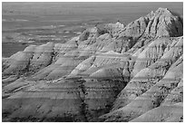 Eroded sedimentary rock layers at sunrise. Badlands National Park ( black and white)