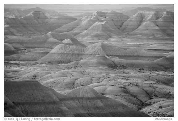 Delicately colored badlands and prairie at sunrise. Badlands National Park, South Dakota, USA.