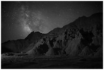 Starry sky and Milky Way above buttes. Badlands National Park, South Dakota, USA. (black and white)