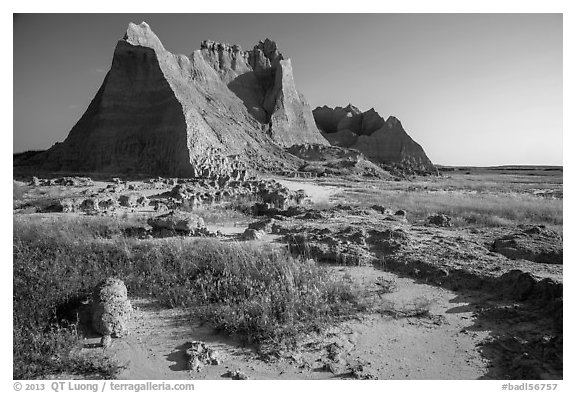 Brule formation butte raising from prairie. Badlands National Park, South Dakota, USA.