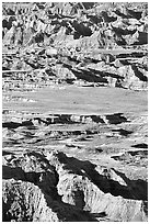 Badlands mixed with prairie from Pinacles overlook, morning. Badlands National Park, South Dakota, USA. (black and white)