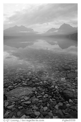 Peebles in lake McDonald and mountains. Glacier National Park, Montana, USA.