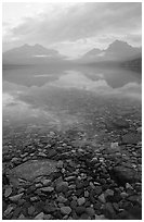 Peebles in lake McDonald and mountains. Glacier National Park, Montana, USA. (black and white)