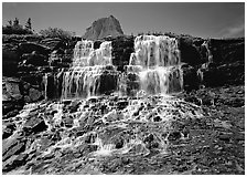 Waterfall at hanging gardens, with top of Mountain. Glacier National Park, Montana, USA. (black and white)