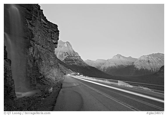 Roadside waterfall and light trail, Going-to-the-Sun road. Glacier National Park, Montana, USA.